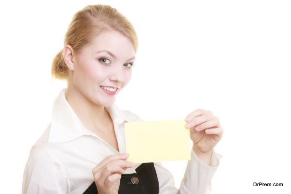 Ad. Businesswoman holding blank copy space card