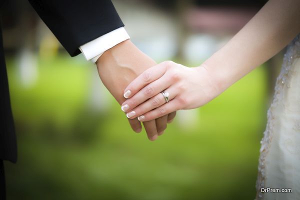 Young married couple holding hands