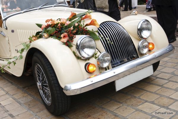 Vintage Wedding Car Decorated with Flowers.