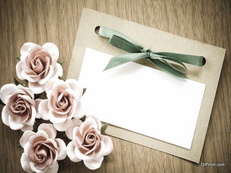 Vintage greeting card and rose flower.