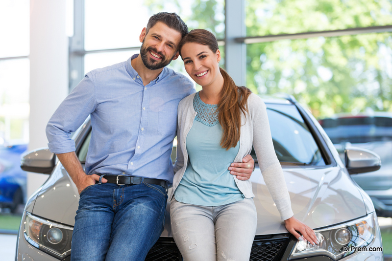 Young couple buying a car